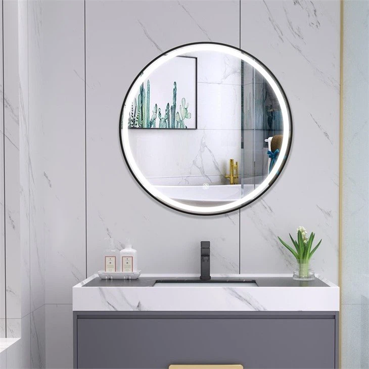 round mirror with light behind